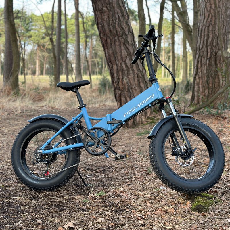 Emovement Pixie Folding Ebike blue colour in the woods